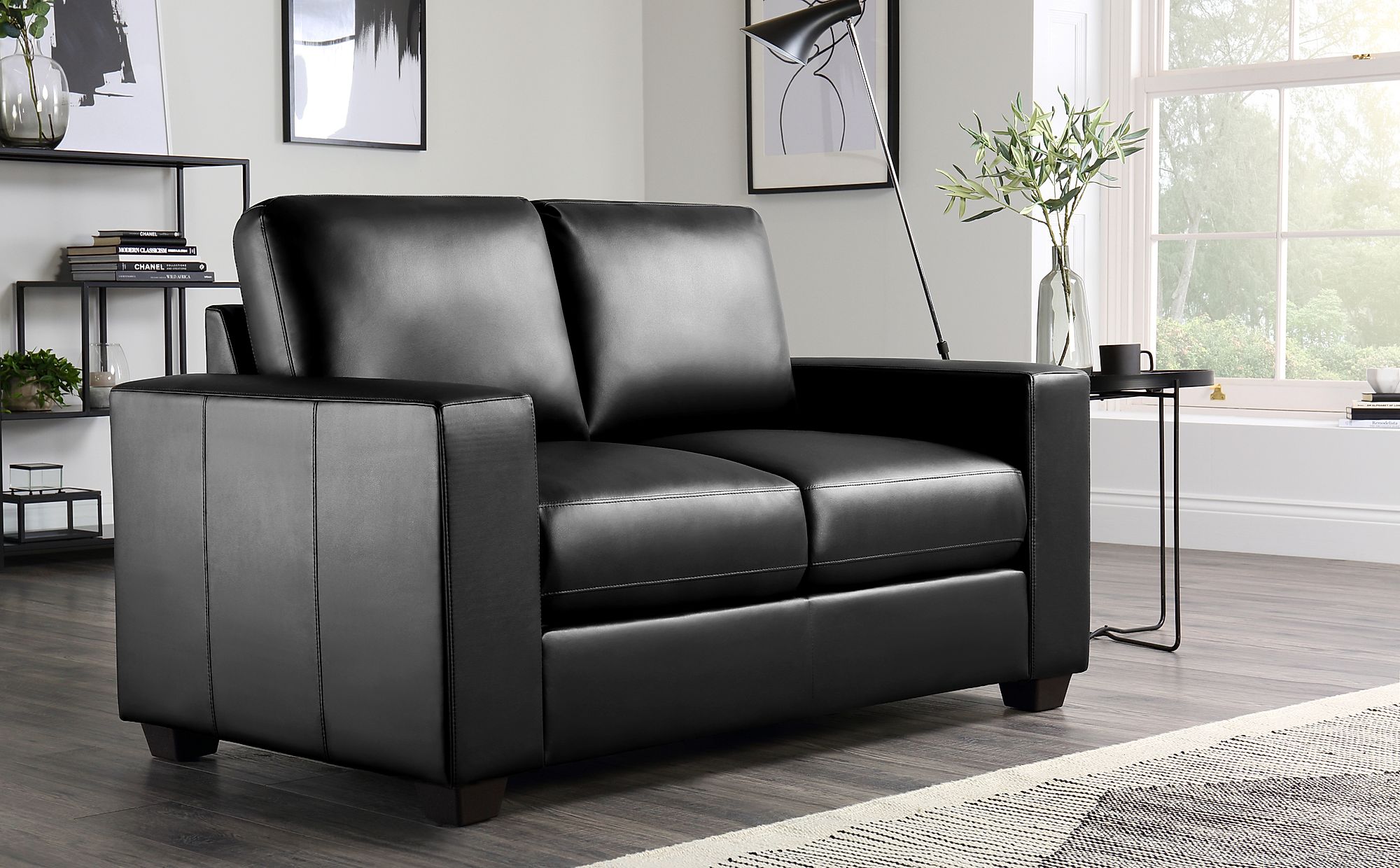 two black leather sofa chairs of second hand