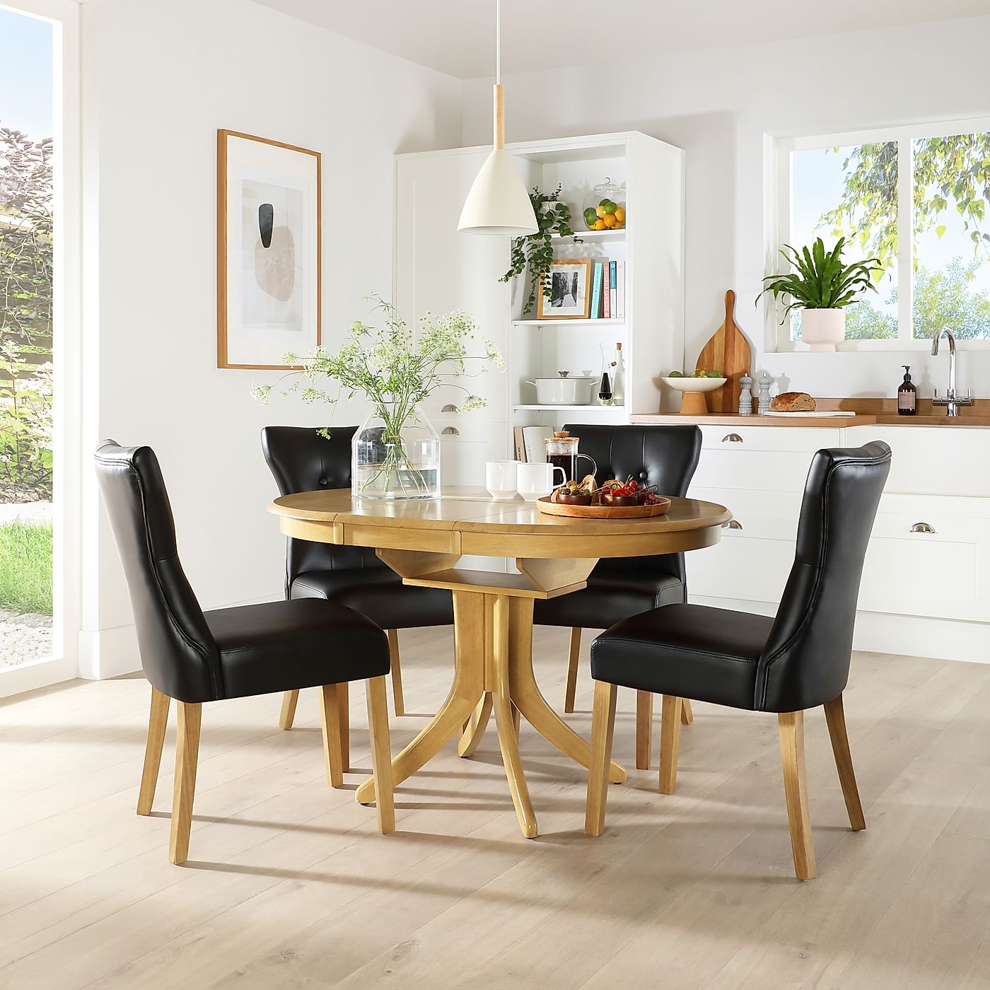 Hudson Round Oak Extending Dining Table with 6 Bewley Black Leather