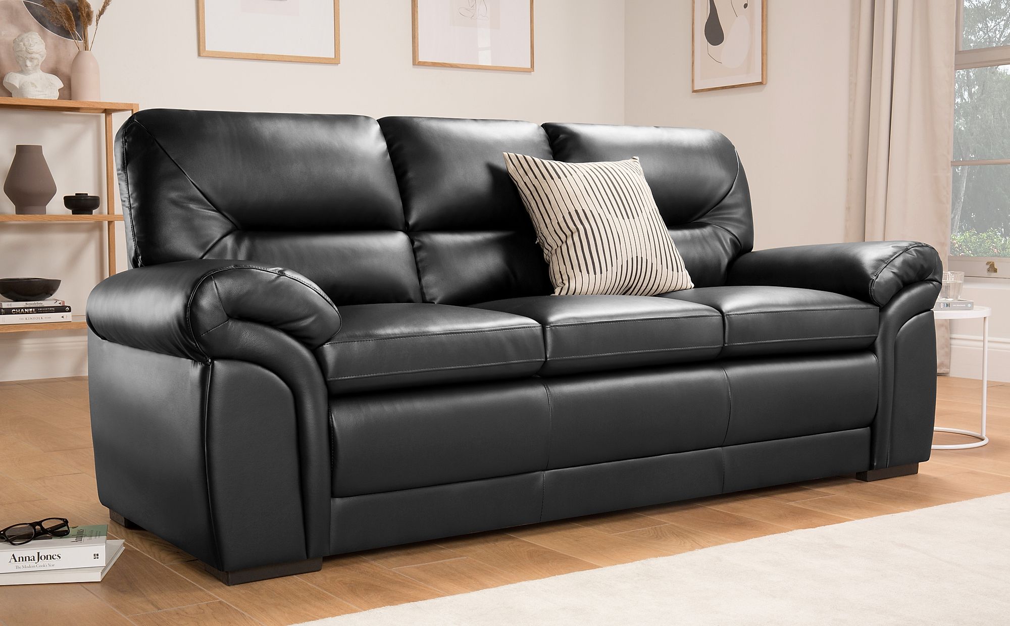 broewn leather sofa black carpet