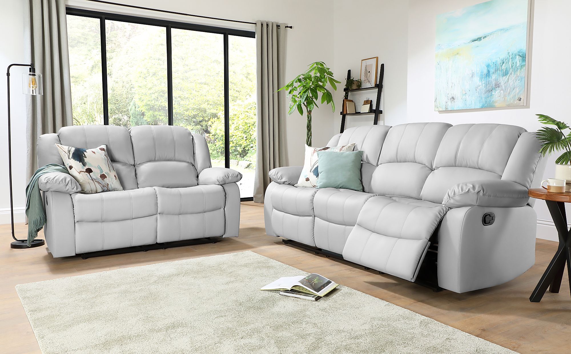grey leather reclining sofa and loveseat