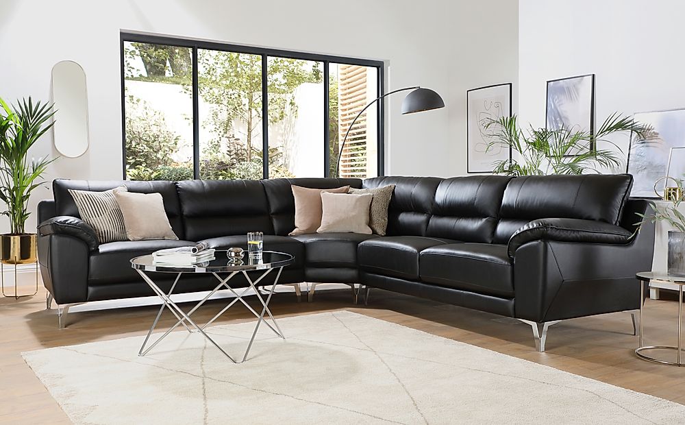 black leather corner sofa with matching rugs