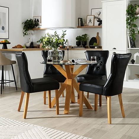 Hatton Round Dining Table & 4 Bewley Chairs, Glass & Natural Oak Finished Solid Hardwood, Black Classic Faux Leather, 100cm