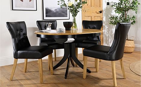 Hudson Round Extending Dining Table & 4 Bewley Chairs, Natural Oak Finish & Black Solid Hardwood, Black Classic Faux Leather & Natural Oak Finished Solid Hardwood, 90-120cm