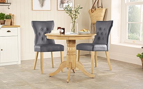 Kingston Round Oak Dining Table with 2 Bewley Grey Leather Chairs