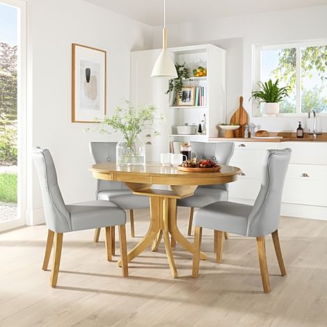Hudson Round Oak Extending Dining Table with 4 Bewley Light Grey Leather Chairs