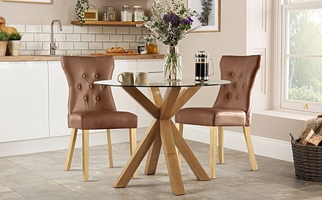 Hatton Round Oak and Glass Dining Table with 2 Bewley Tan Leather Chairs