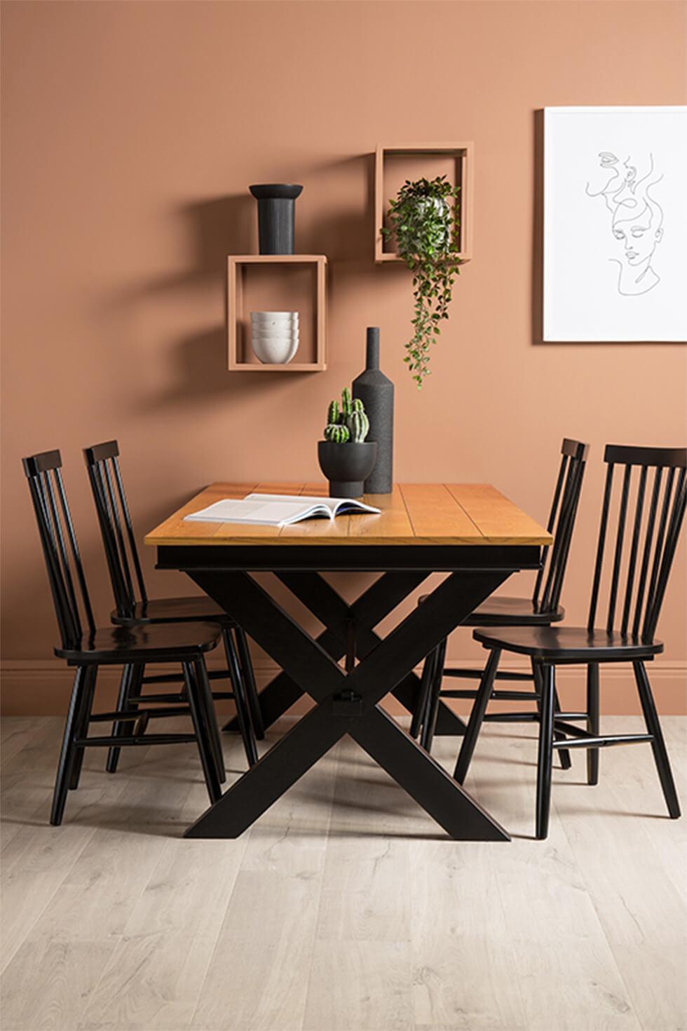 black and oak two tone dining table in a contemporary dining room