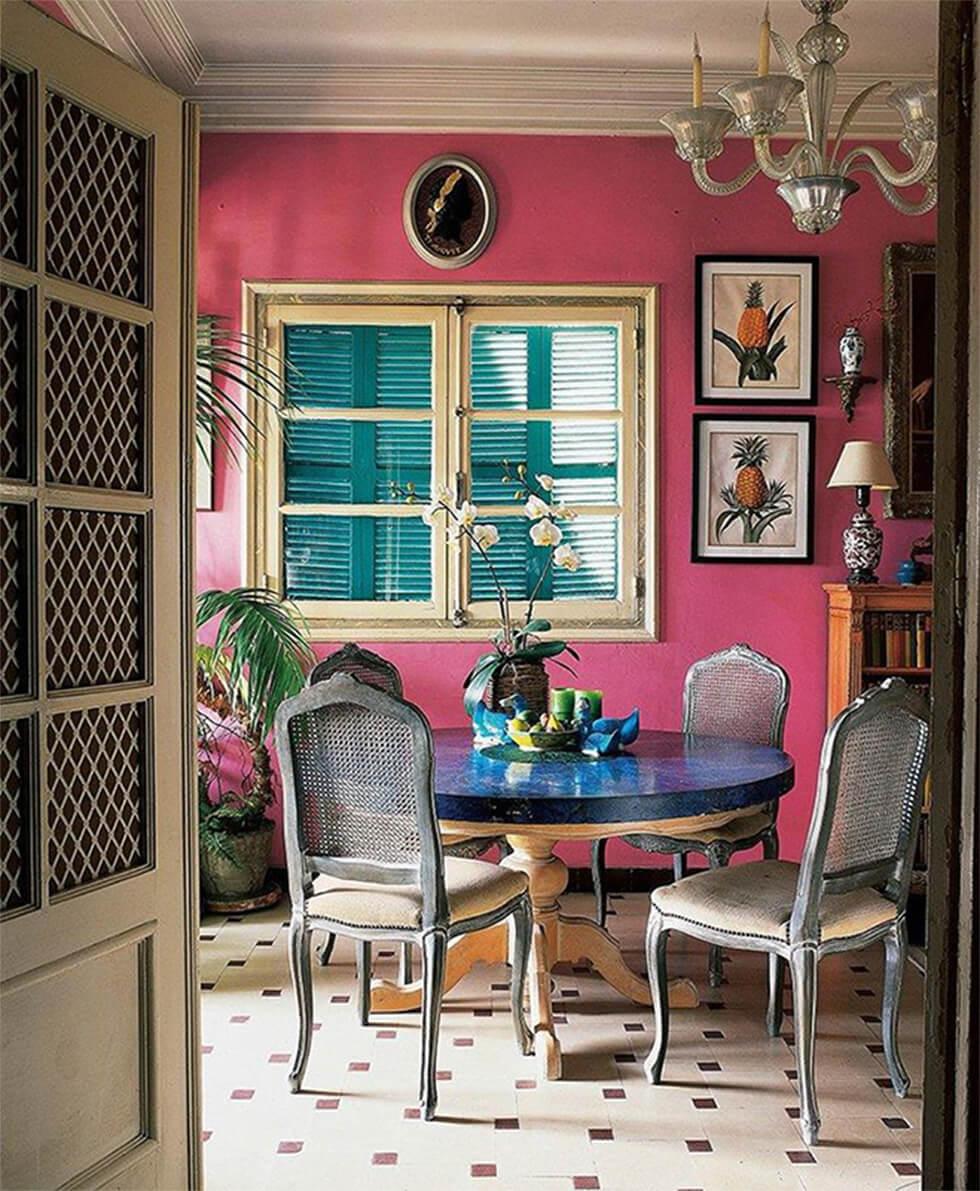 bright pink walls in a colourful modern dining room