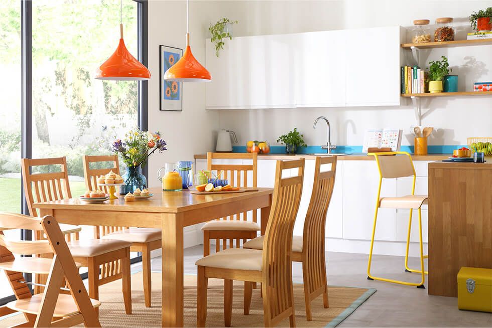 Modern white kitchen-diner with an oak dining set