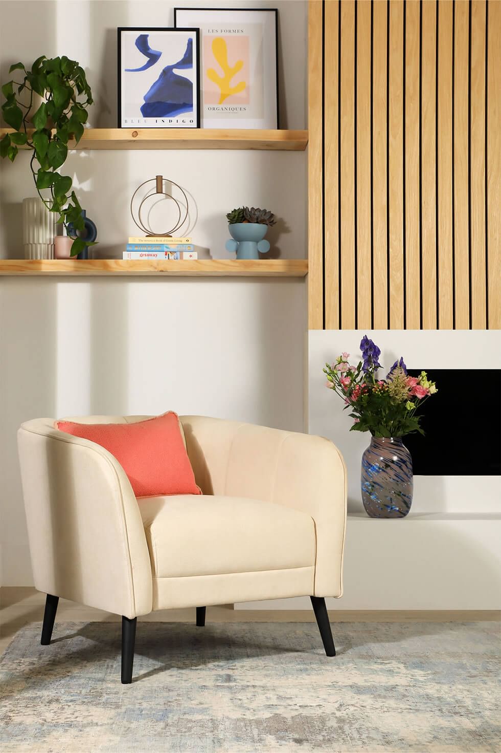 Slat wood panelling and open shelves on a living room feature wall