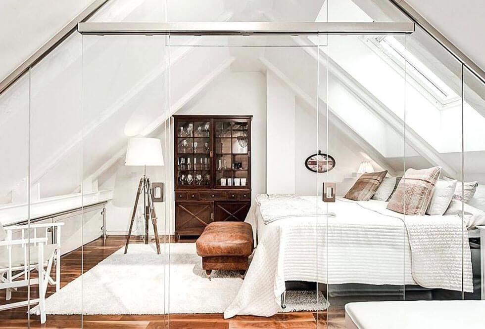 White loft bedroom with glass panelling