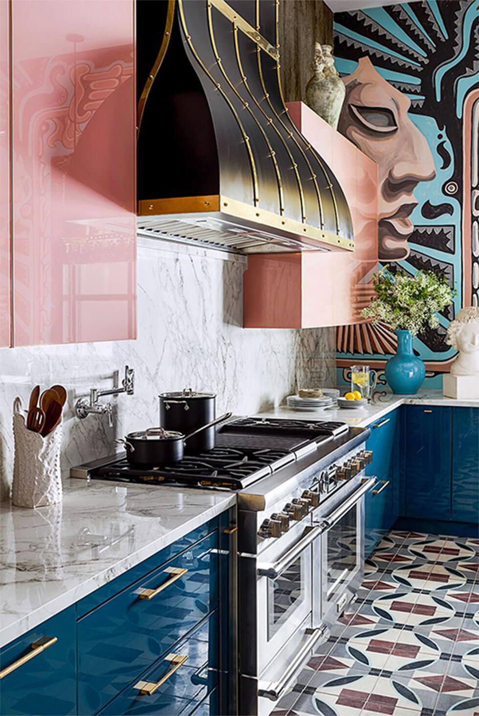 Luxurious high gloss small kitchen with pink cabinets, dark teal drawers and geometric tiles