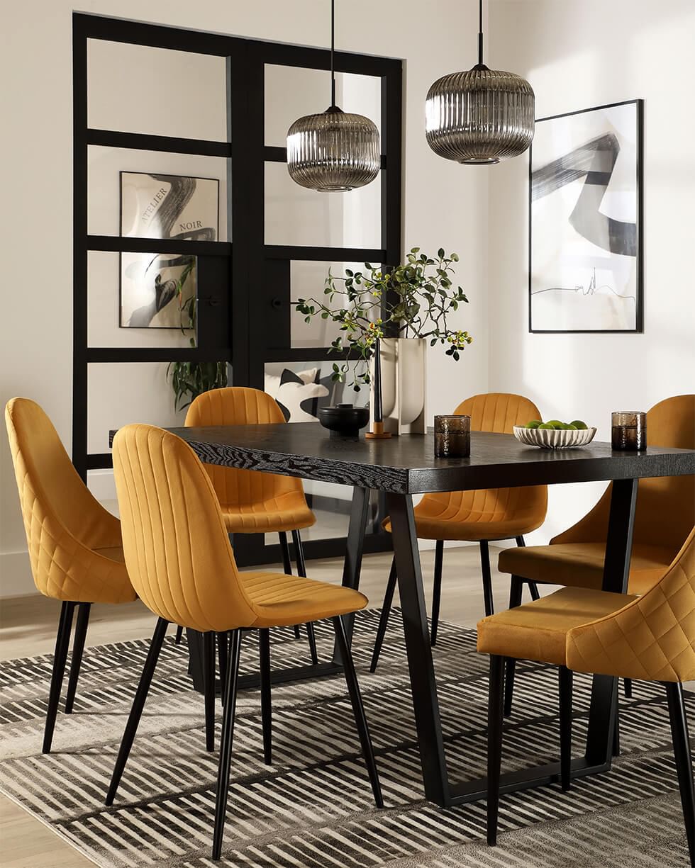 Modern dining chairs with mismatched designs in a dining room
