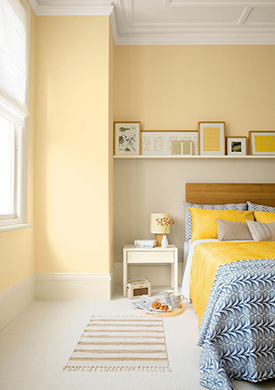 Light yellow walls in a soothing modern bedroom