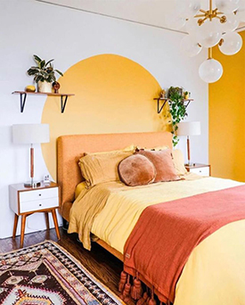 Painted yellow motif as a creative headboard