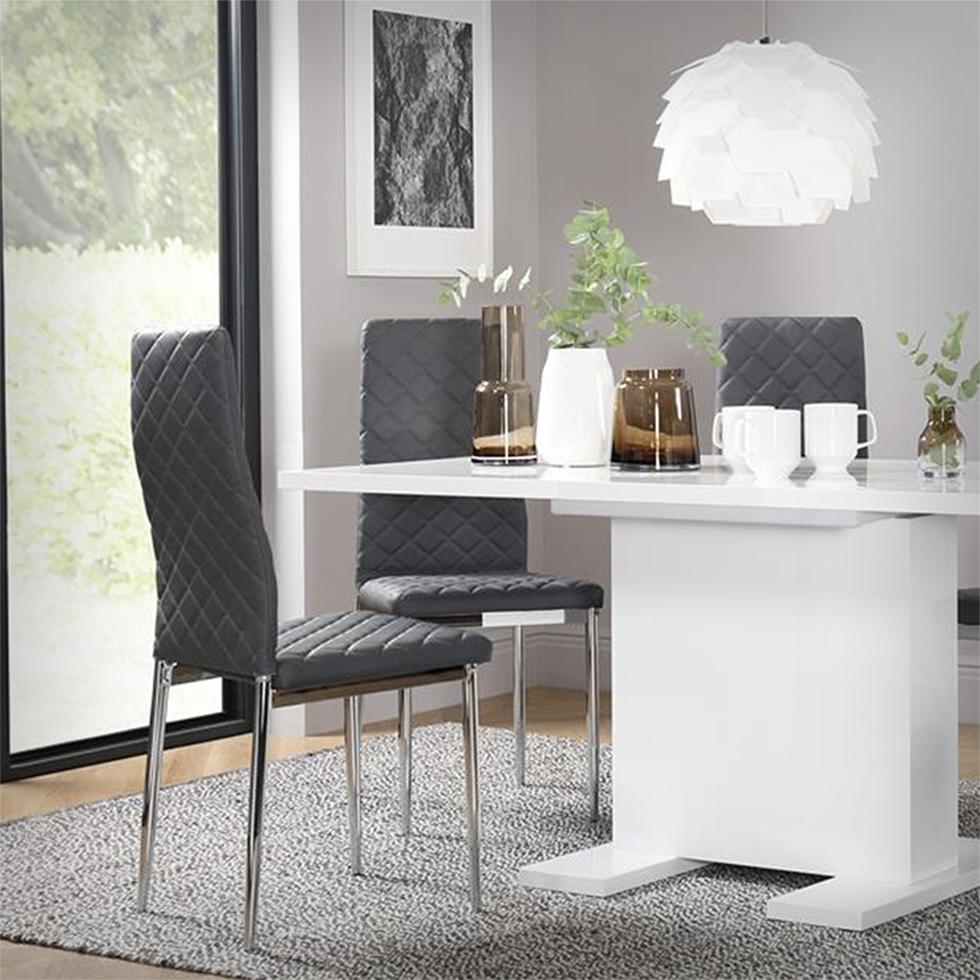 White high gloss dining table with grey leather chairs in a modern grey dining room