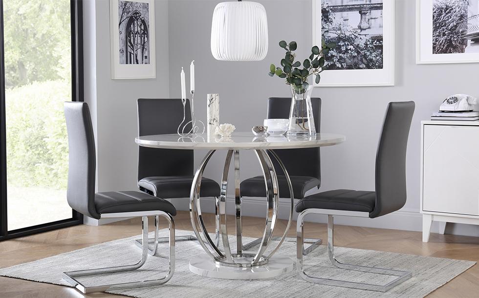 Marble and chrome dining table with grey velvet chairs in a grey modern dining room
