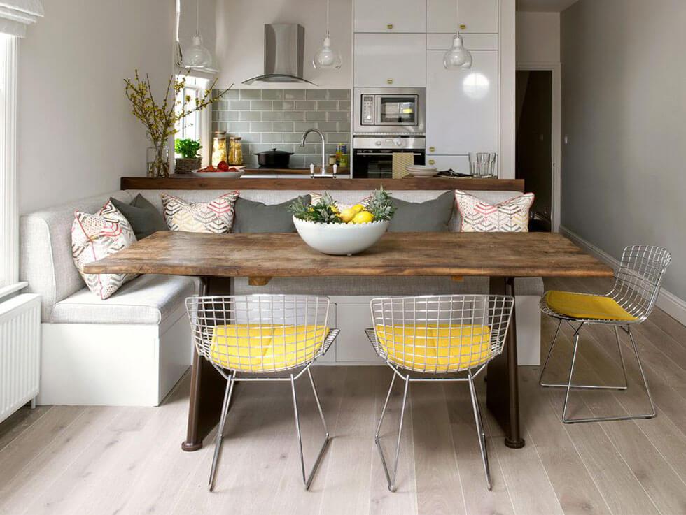 bright pops of yellow seats in a fun grey dining room