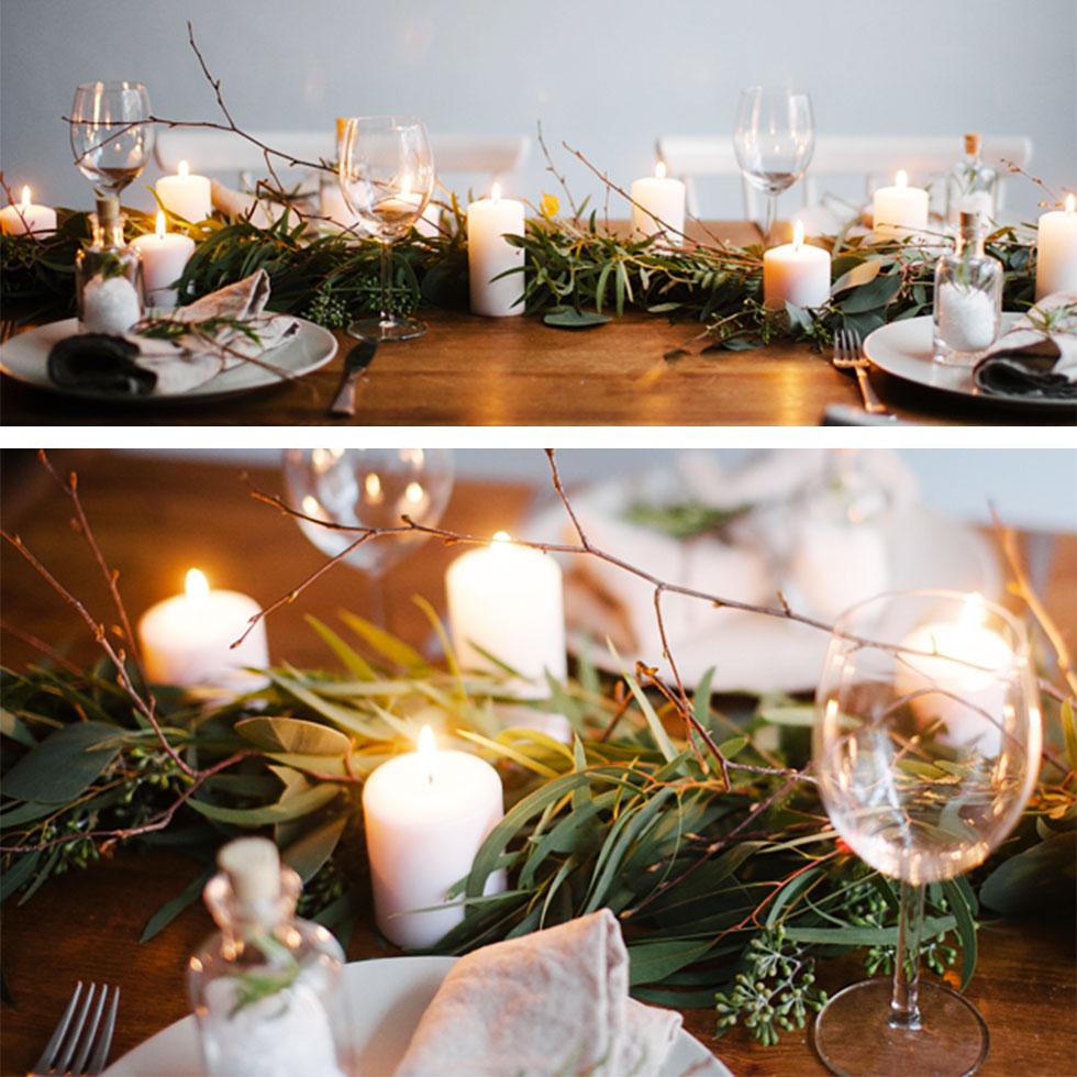 Table centrepiece with leaves and candles.