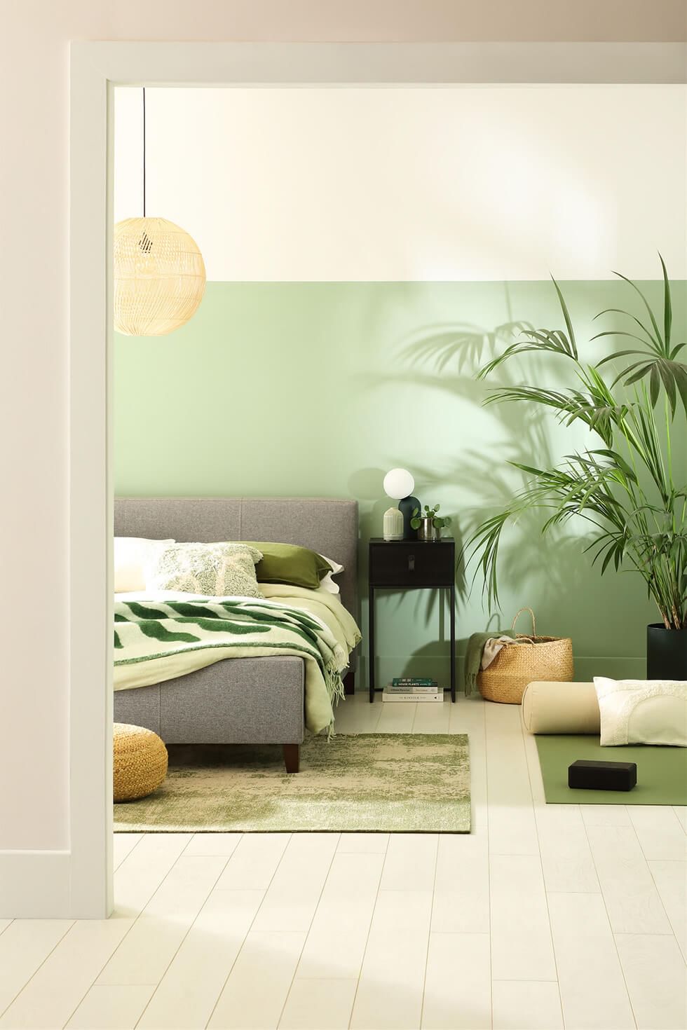 Modern bedroom with a soothing green wall