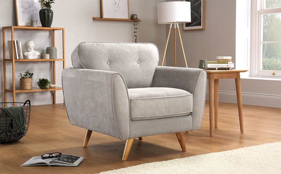 Armchair with wooden legs in a modern Scandi style living room