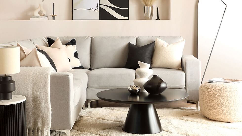 Scandi living room in monochrome colours with a corner sofa