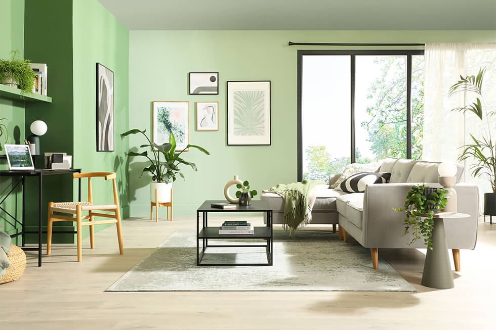 Pastel green coloured living room with a Scandi sofa