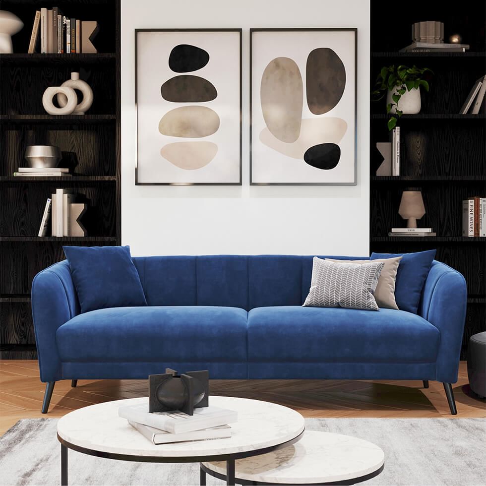 A plush and luxurious blue velvet sofa