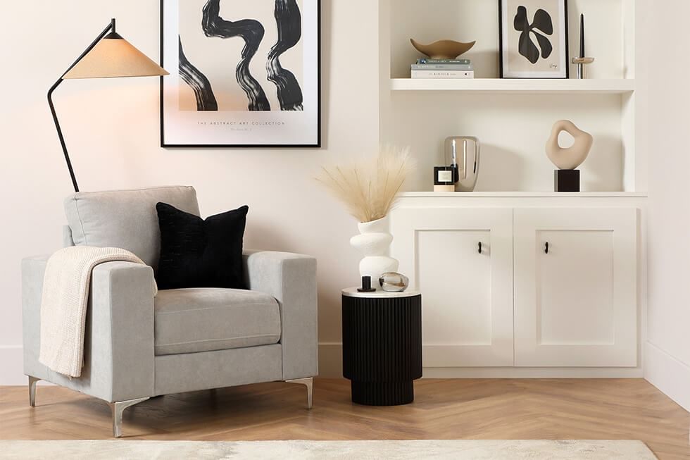 Reading corner with a cosy armchair and monochrome interior