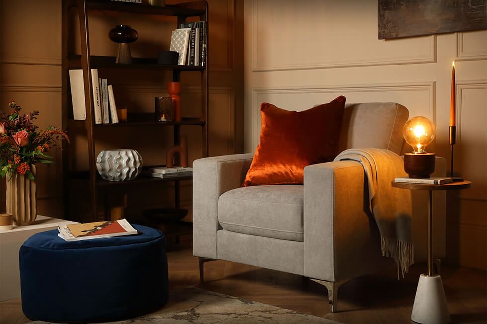 Cosy reading nook with warm lighting and a comfy armchair
