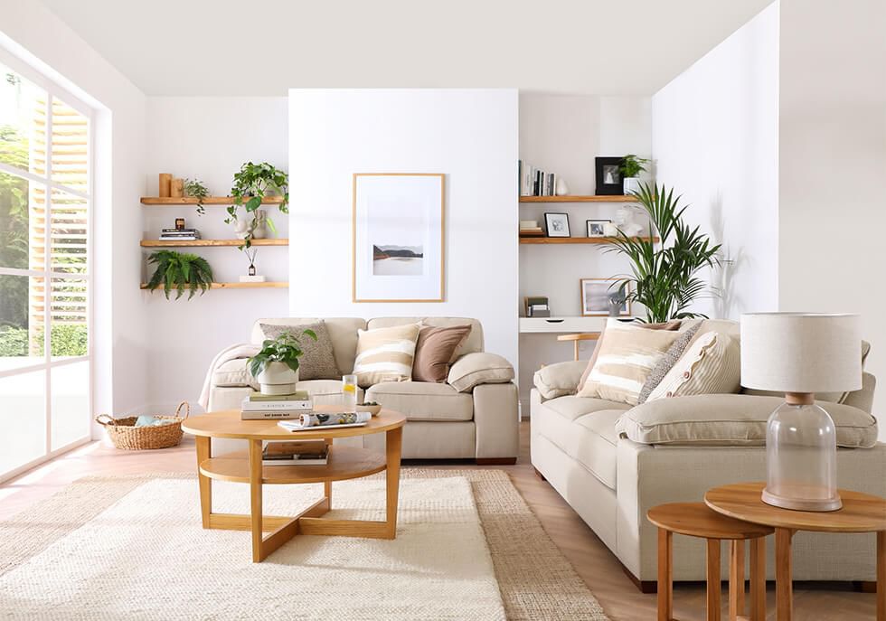 Bright living room featuring a fabric sofa set and wooden furniture