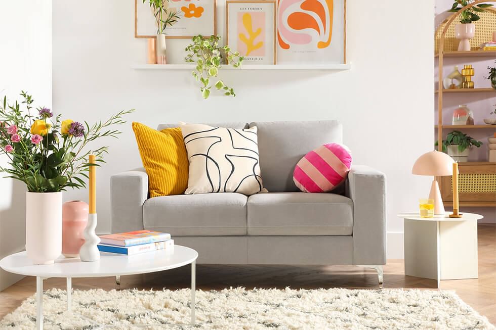 Plush fabric sofa in a bright and colourful living room