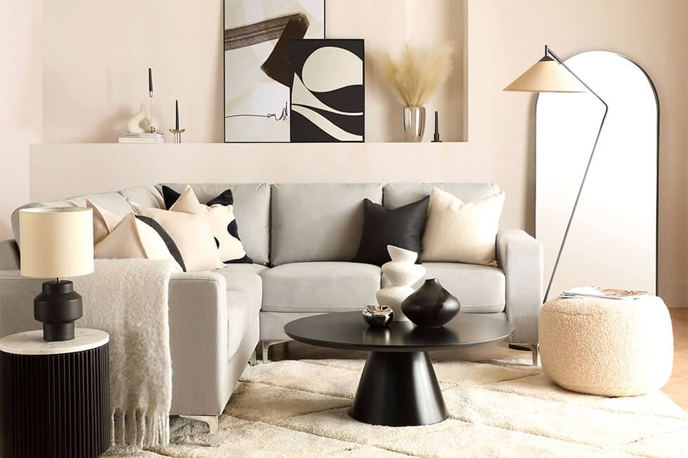Plush fabric grey corner sofa in a modern living room