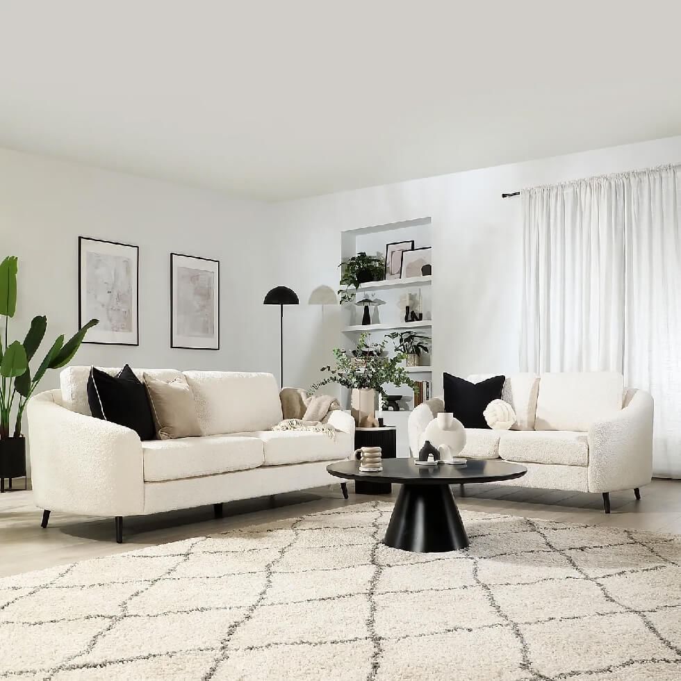 White living room with high ceiling