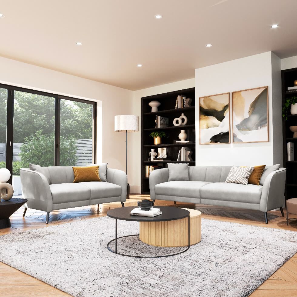 A white living room zoned with a rug in the middle