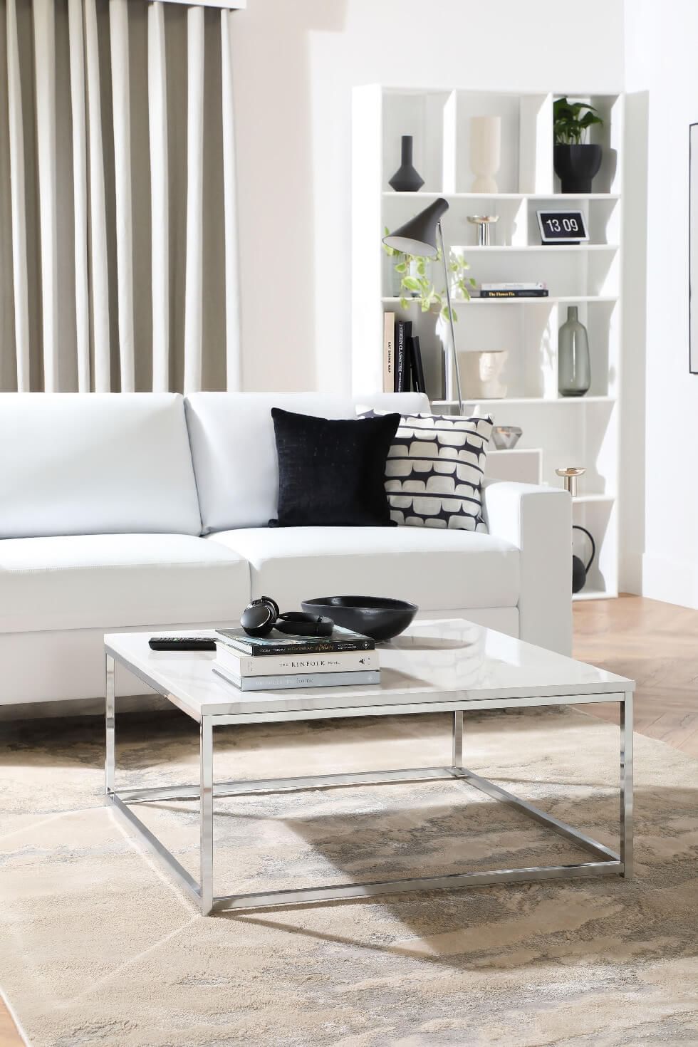 White living room with built-in cabinets
