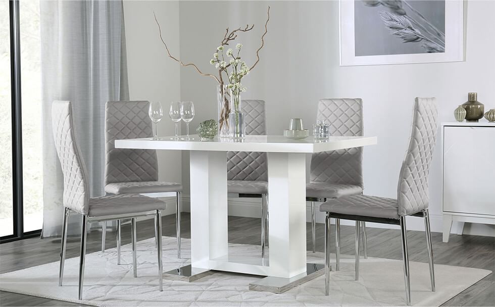 Stylish dining set with chrome details in a grey dining room