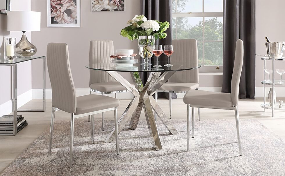 Stone grey dining chairs with a glass and chrome dining table in a greige dining room