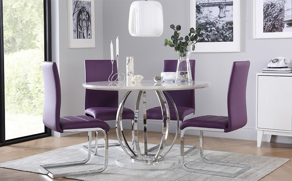 Purple dining chairs with chrome details in a chic grey dining room