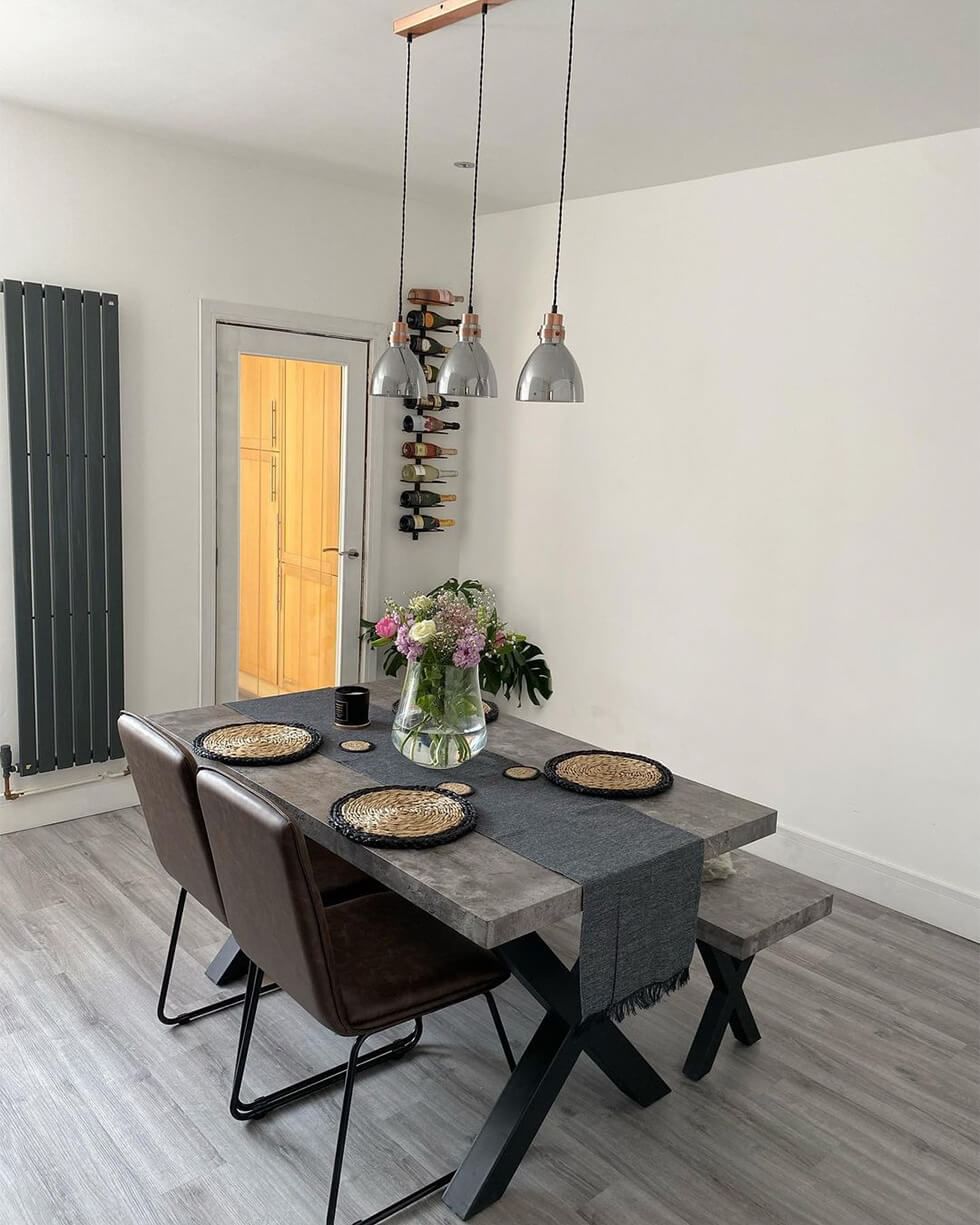 Industrial style grey dining room with a matching industrial dining set