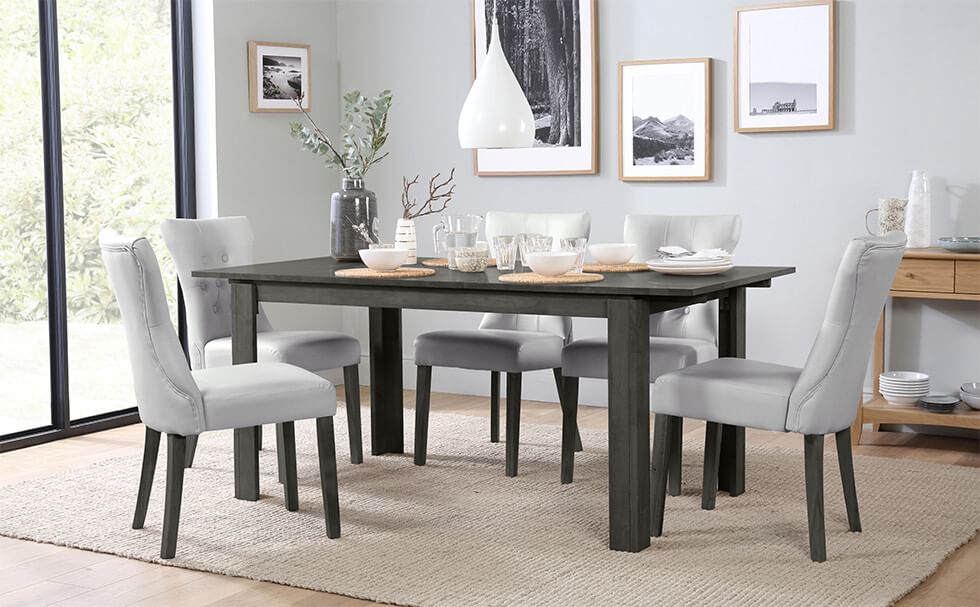 Grey dining room with dark grey wood dining table and matching grey dining chairs