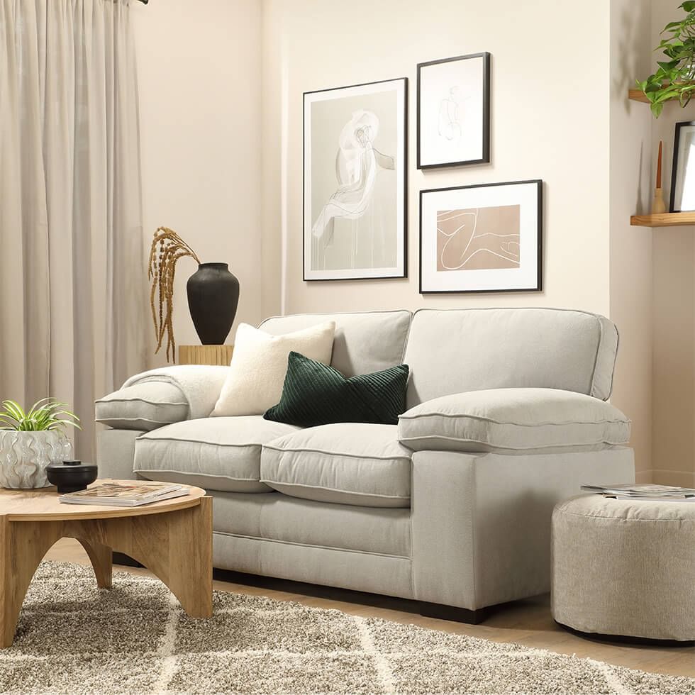 Greige living room with a plush fabric grey sofa