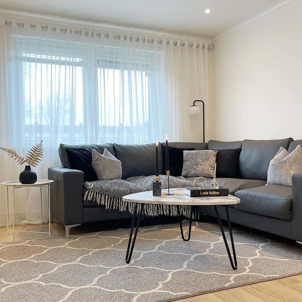 Grey corner sofa in a cosy grey living room