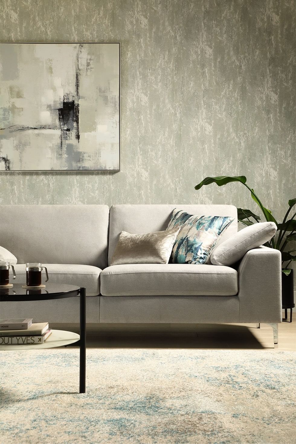 Modern living room with grey sofa and wallpaper