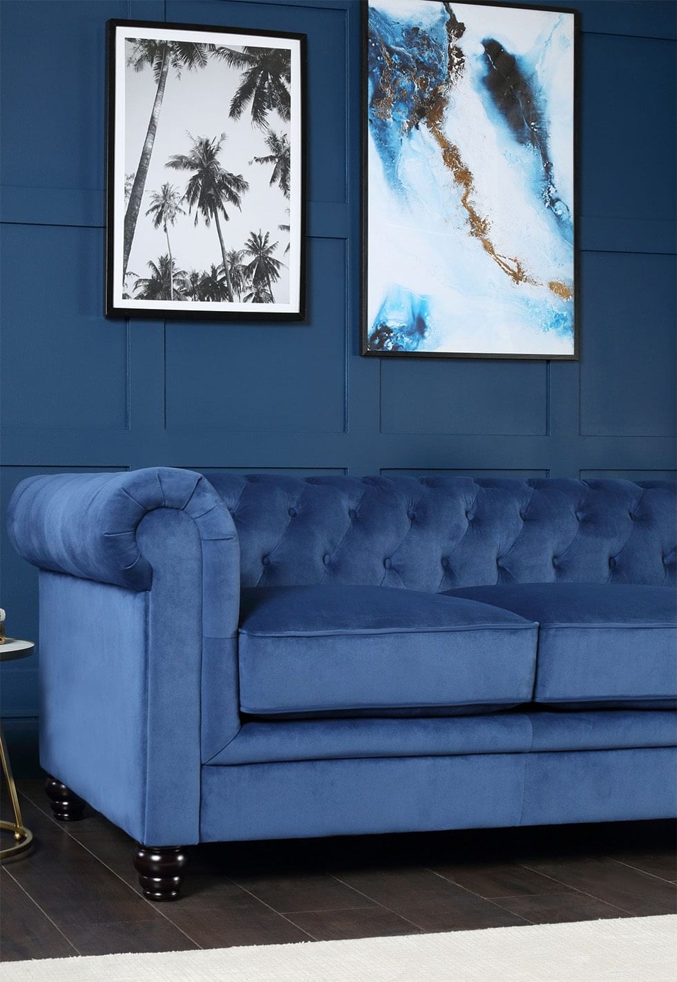 Jewel tone modern living room with a blue velvet sofa