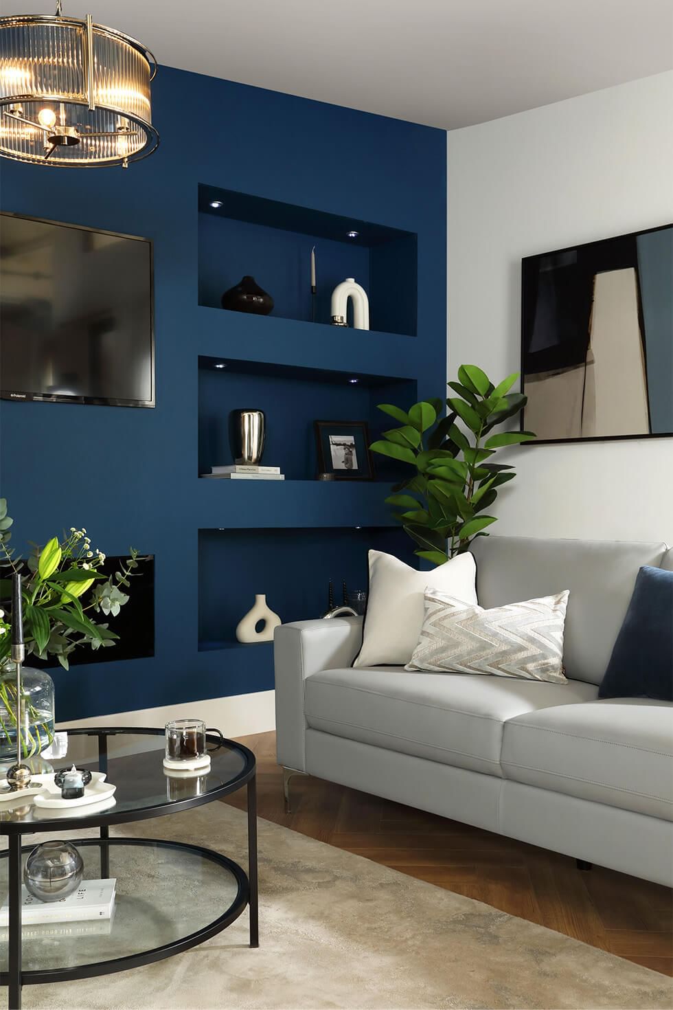 Navy blue living room with a media wall
