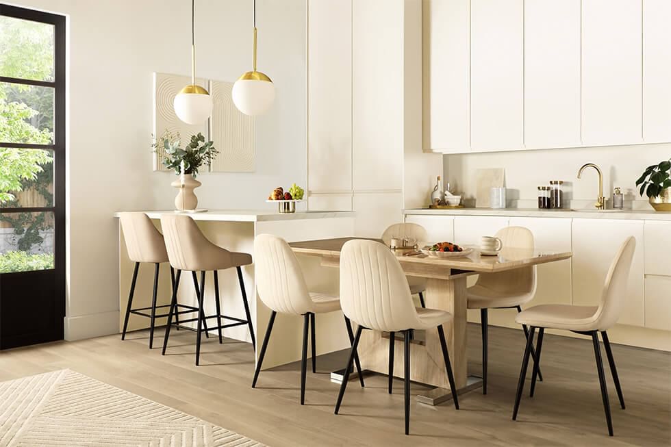Marble dining set connected to kitchen island in a small kitchen diner