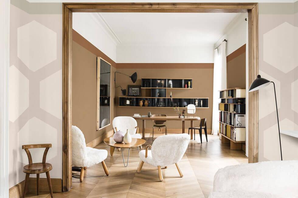 Stylish living room with caramel walls and black shelves.