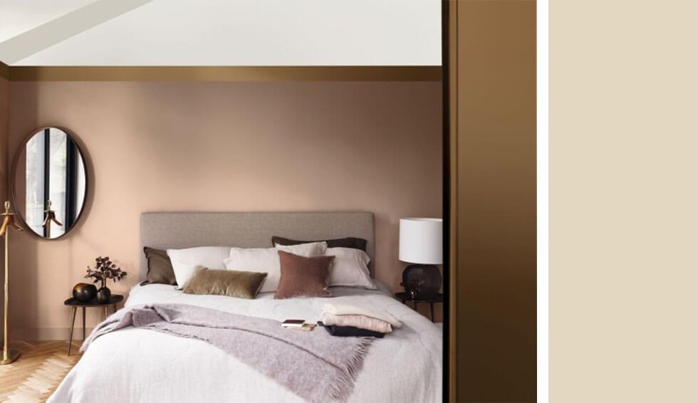 Cosy bedroom with caramel walls and comfy bedding