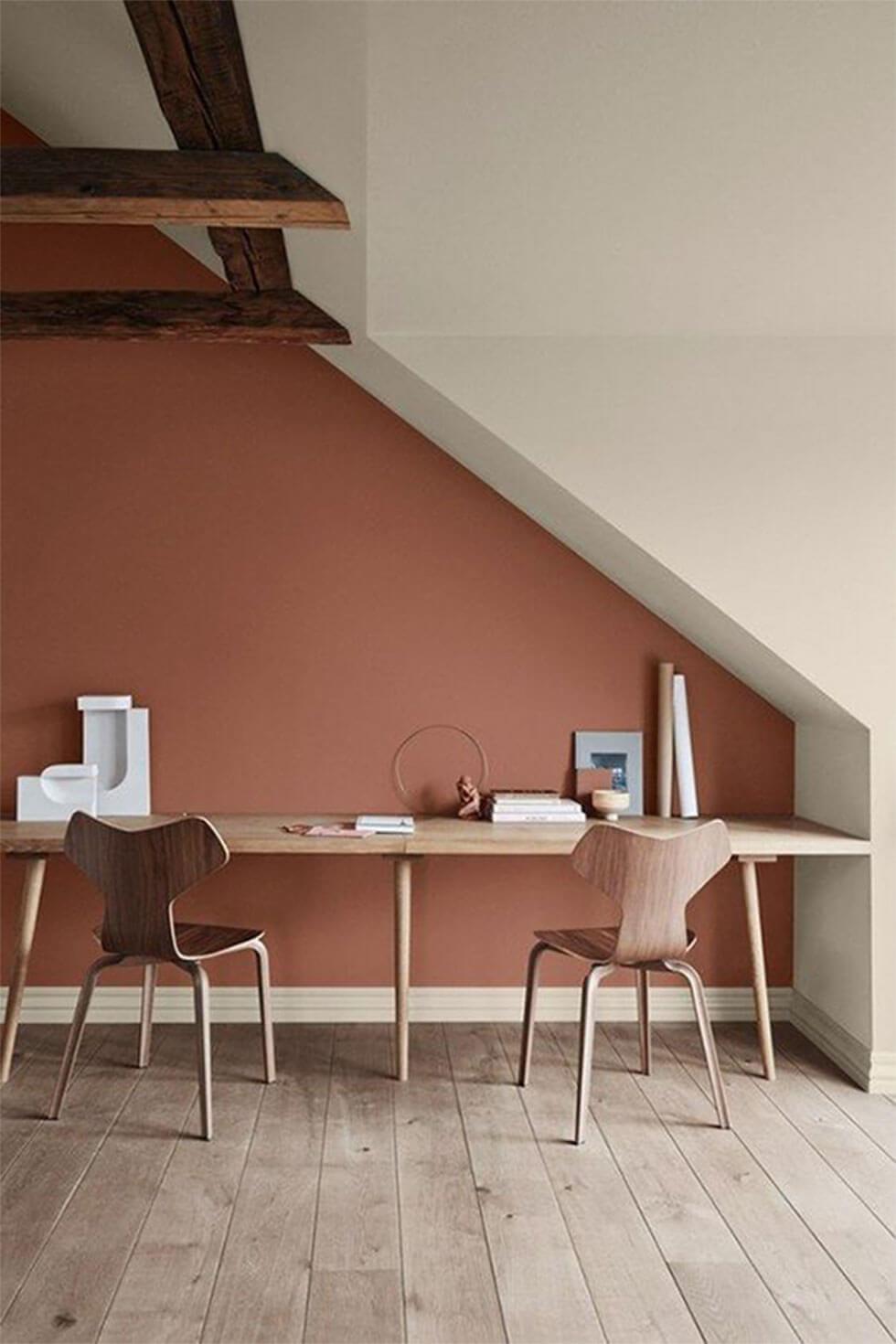 Home office with terracotta walls and oak furniture